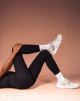Black high-waist yoga leggings from Theia Moon, soft second-skin feel