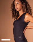 Black tank top for women by Theia Moon, perfect for yoga and workouts