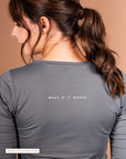 Positive back message on the gray Theia Moon 3/4 sleeve top